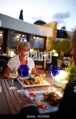 Couple having dinner at restaurant Ariadne, Elounda Beach Resort, Elounda, Crete, Greece Stock Photo