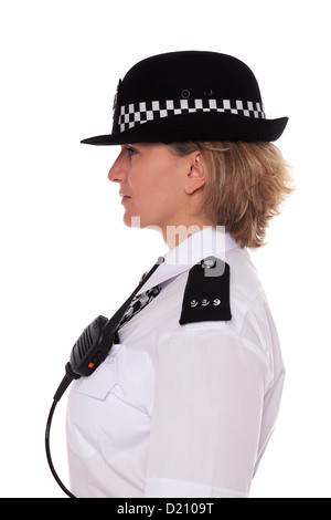 Studio shot of a female British Police officer in uniform, side profile showing her epaulettes and radio mic. Stock Photo