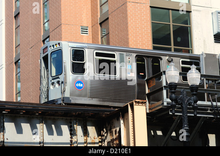 USA Illinois Chicago CTA rapid transit Orange Line elevated train travels along tracks on an elevated structure. Stock Photo