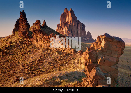 Shiprock, sacred Navajo mountain, monolith, at sunset, from black dike ridge, New Mexico, USA Stock Photo