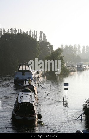 Early morning scene the River Thames flooding Abingdon Oxfordshire July 2007, stranded boats on a flood foot path. Stock Photo