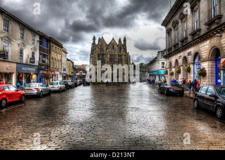 Boscawen Street, Truro, Cornwall, England, UK. Shops along cobbled street in the city centre on wet day Stock Photo