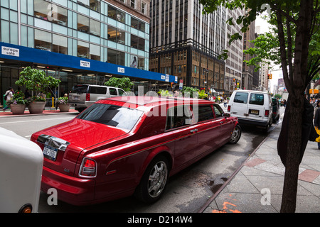 huge stretch limo red Rolls Royce parked on streets of Manhattan New York City, NYC, NY, USA, America Stock Photo