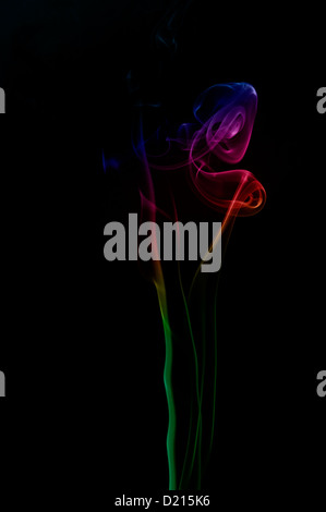 Coloured smoke against a black background Stock Photo