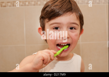 Cute boy washing his teeth. it is important to teach children from an early age the importance of oral hygiene. Stock Photo