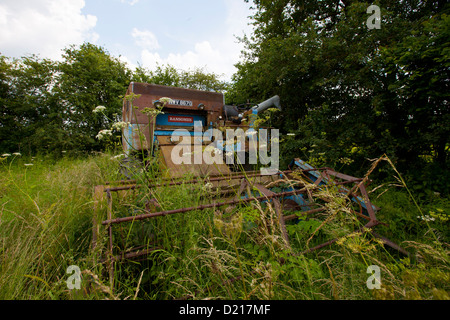 Abandoned Farm machinery is left to rust in overgrown fields near Droitwich, Worcestershire Stock Photo