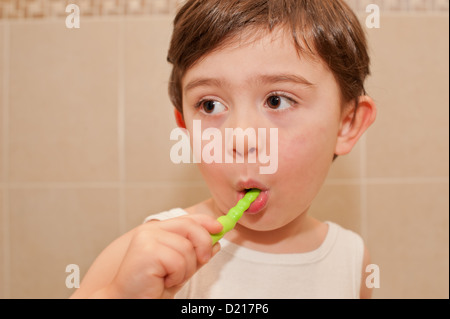 Cute boy washing his teeth. it is important to teach children from an early age the importance of oral hygiene. Stock Photo