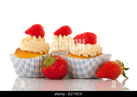 Strawberry cupcakes with buttercream isolated over white background Stock Photo