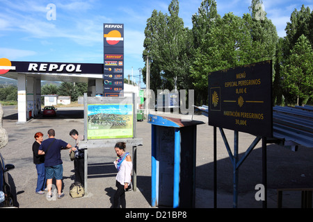 Sign offering lodging and food for pilgrims on the Way of St James at petrol station at Sanabria , Spain Stock Photo