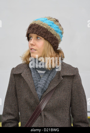 Young British woman wearing winter clothing, Amsterdam, Noord Holland, Netherlands Stock Photo