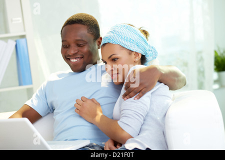 Lovely couple enjoying online communication Stock Photo