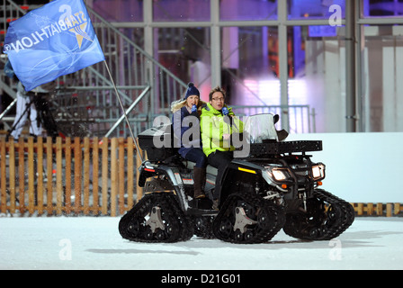 AATENTION: EMBARGO CONDITION: 10 JANUARY, 22:00 O'CLOCK - Former boiathlete Magdalena Neuner and presenter Matthias Opdenhoevel drive a winter quad during the Star Biathlon in Ruhpolding, Germany, 09 January 2013. Celebreties and biathlete legends competed in the Star Biathlon, which was held after the Biathlon World Cup. Photo: TOBIAS HASE Stock Photo