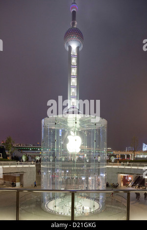 Glass stairway to Apple store in front of Oriental Pearl Tower at night, Pudong, Shanghai, China, Asia Stock Photo