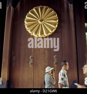 Visitors enter through the main gate at the Yasukuni Shrine in Tokyo, Japan Stock Photo