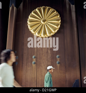 Visitors enter through the main gate at the Yasukuni Shrine in Tokyo, Japan Stock Photo