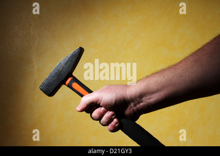 mens hand holding a hammer Stock Photo