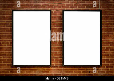 Two blank billboards attached to a buildings exterior brick wall. Stock Photo