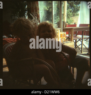 a boy and a girl sitting Stock Photo - Alamy