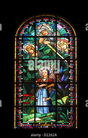 Saint Catherine, Saint Michael, Saint Margaret and Joan of Arc, stained glass, Notre Dame de Clignancourt church, Paris, France Stock Photo