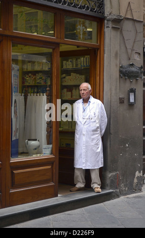 Portrait of a pharmacist in Lucca, Italy standing outside his shop.pensioner, entranceway, front door, chemist, Stock Photo
