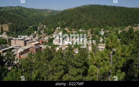 Blue sky pine trees view, from Mount Moriah Cemetery, Deadwood in valley gulch below green hills, South Dakota, USA Stock Photo