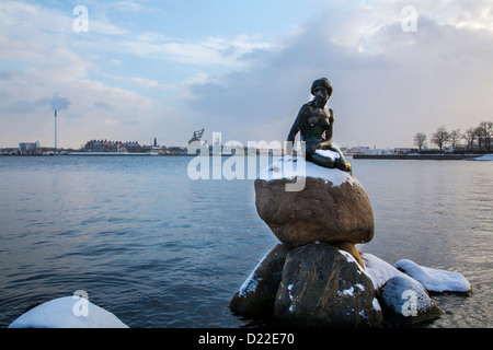 Wintertime in Copenhagen. Little mermaid sculpture in the port area, covered with snow. Copenhagen, Denmark, Europe Stock Photo