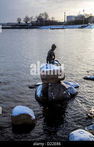 Wintertime in Copenhagen. Little mermaid sculpture in the port area, covered with snow. Copenhagen, Denmark, Europe Stock Photo