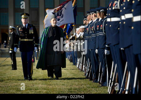 120110-D-TT977-048U.S. Army Col. James Markert escorts Afghanistan's President Hamid Karzai as he inspects the troops in formation on the Pentagon River Parade Field on Jan. 10, 2013.  Secretary of Defense Leon E. Panetta is hosting the full honors arrival ceremony to welcome Karzai to the Pentagon.  Panetta, Karzai and their senior advisors will meet to discuss national security items of interest to both nations.  DoD photo by Petty Officer 1st Class Chad J. McNeeley, U.S. Navy.  (Released) Stock Photo