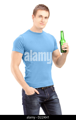 Young handsome man holding a bottle of beer isolated on white background Stock Photo