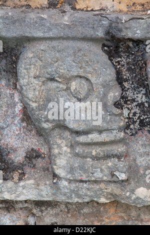 Stone carved skull on The Tzompantli at Chichen Itza, Yucatan, Mexico Stock Photo