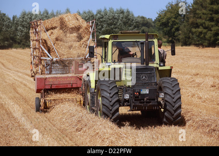 Hamm, Germany, straw harvest with an old baler Stock Photo