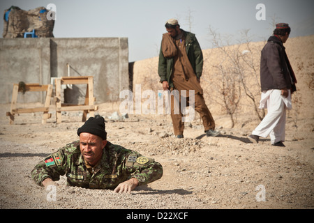 An Afghan National Army Soldier demonstrates counter improvised explosive device tactics during training in Farah province, Afghanistan, Jan.10, 2013. Afghan National Security Forces have been taking the lead in security operations, with coalition forces Stock Photo