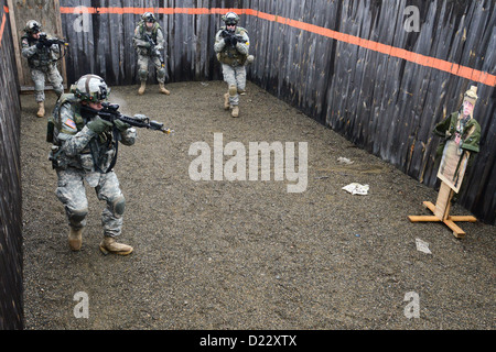 U.S. Army Soldiers, assigned to Bravo Company, 1st Battalion, 4th Infantry Regiment, practice clearing a building at the Grafenwoehr Training Area, Jan. 10, 2013. The Soldiers of 1-4 Infantry are U.S. Army Europe's professional opposing force for training