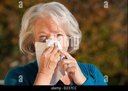 Elderly woman has flu Stock Photo