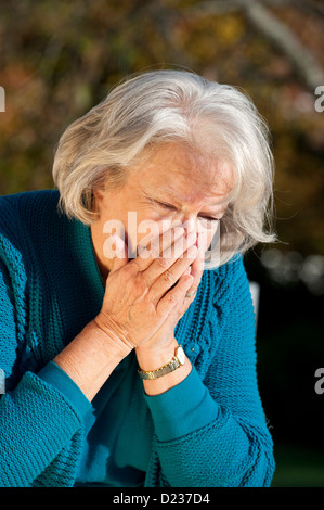 Elderly woman has flu Stock Photo