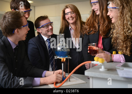 Head Master Russel Ellicott with pupils conducting a chemistry experiment during a science lesson at Pates Grammar School in Che Stock Photo