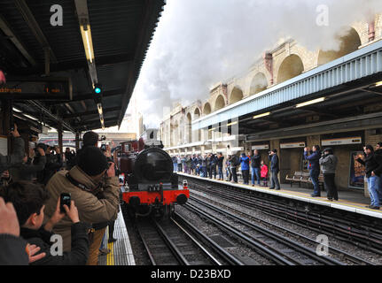 Barbican Station, London, UK. 13th January 2013. A steam train runs on the London Underground to mark the 150th anniversary of the Underground system. Met Locomotive No1 at the back of the train consisting of restored Metropolitan and Chesham coaches and the  electric locomotive 'Sarah Siddons' at the front. Stock Photo