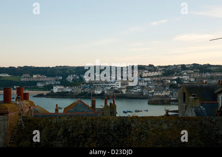 Harbour views a over rooftops at St Ives, Cornwall at dusk Stock Photo