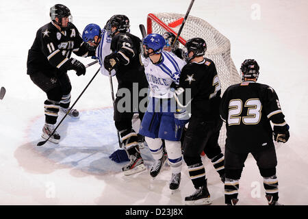 Junior Jason Fabian tries for a goal as Air Force met the Army Black Knights at the U.S. Air Force Academy's Cadet Ice Arena Jan. 12, 2013, in Colorado Springs, Colo. The Falcons and the Black Knights skated to a 3-3 overtime tie. Air Force defeated Army the night before, 4-1. (Air Force photo/Mike Kaplan) Stock Photo