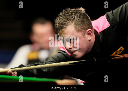 London, UK. 13th Jan, 2013. Mark Allen in action against Mark Davis during the Masters Snooker from Alexandra Palace. Stock Photo