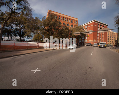 X marks the spot where a bullet hit President Kennedy on 11/22/63, was it Oswald in the School Book Depository (left) or another Stock Photo