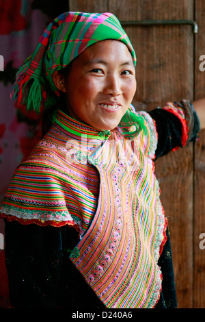 Portrait of a colourful Flower Hmong girl at a village near Bac Ha in North West  Vietnam, Asia. Stock Photo