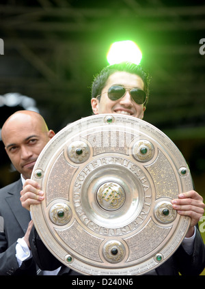 FILE - An archive picture dated 15 May 2011 shows Dortmund's players Dede and Nuri Sahin (R) celebrating with the German soccer championship shield during championship celebration of Bundesliga soccer club Borussia Dortmund in front of Westfalenhalle in Dortmund, Germany. According to media reports on 11 January 2013 German soccer champion Borussia Dortmund has landed a transfer coup and signed its former player Nuri Sahin. Photo: Federico Gambarini Stock Photo