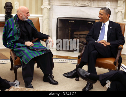 United States President Barack Obama, right, meets with President Hamid Karzai of Afghanistan, left, in the Oval Office at the White House, January 11, 2013 in Washington, DC. Karzai is on a visit in Washington to discuss the continued transition in Afghanistan and the partnership between the two nations..Credit: Mark Wilson / Pool via CNP Stock Photo