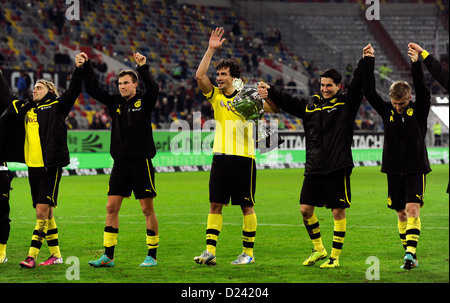 Dortmund's Marcel Schmelzer (L-R), Kevin Grosskreutz, Mats Hummels, Nuri Sahin and Jakub Blaszczykowski after winning the Winter Cup at Esprit Arena in Duesseldorf, Germany, 13 January 2013. Photo: Marius Becker Stock Photo