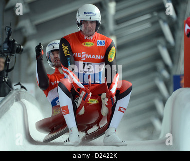 Austrian lugers Peter Penz (FRONT) and Georg Fischler celebrate after their run in the FIL European Luge Championships in Oberhof, Germany, 12 January 2013. They finished in third place. Photo: Hendrik Schmidt Stock Photo