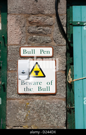 Sign on wall at farm warning of a bull. Stock Photo