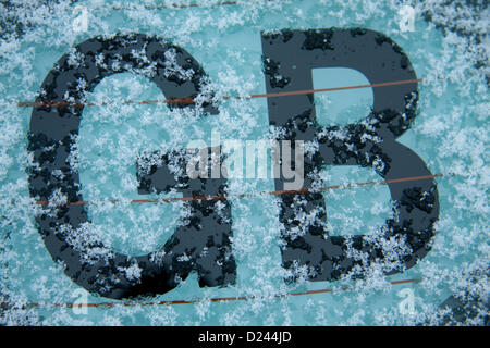 London UK.14th January 2013. A GB car sticker is covered with morning snow with freezing conditions affecting many parts of the United Kingdom. The met office has forecast  rain sleet and snow to hit the United Kingdom  today and to continue for most of the week. Credit:  amer ghazzal / Alamy Live News Stock Photo