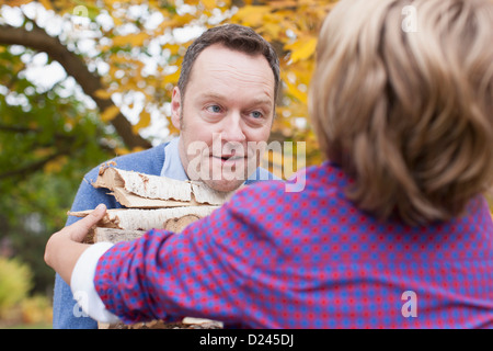 Germany, Leipzig, Father and son collecting firewood Stock Photo