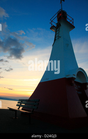 Warning light at the end of  breakwater before entering into the harbour in Victoria BC Canada Stock Photo